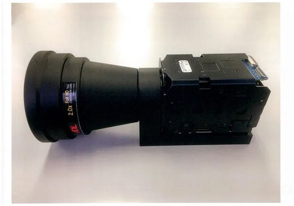 Large camera lens with a housing on a white background